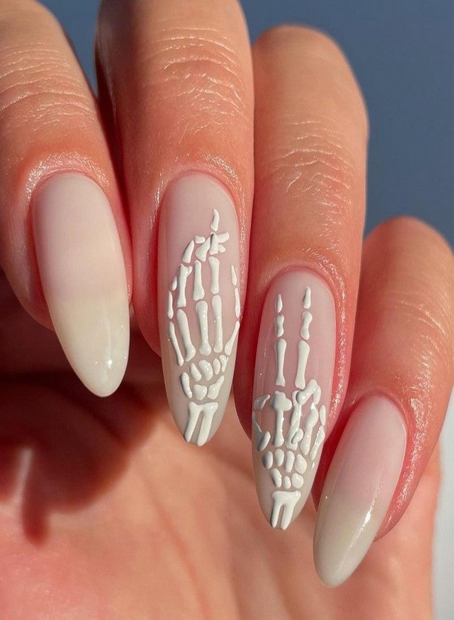 OCOUYVD 24 Pcs Halloween Press On Nails - Medium Almond, 3D White Skull Designs, French Tip, Glossy False Nails - DIY Manicure - Image 1